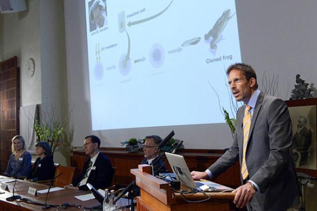 Thomas Perlmann of Karolinska Institute presents Sir John B Gurdon of Britain and Shinya Yamanaka of Japan as winners of the 2012 Nobel Prize in medicine or physiology, in Stockholm, on Monday. Photo: AP