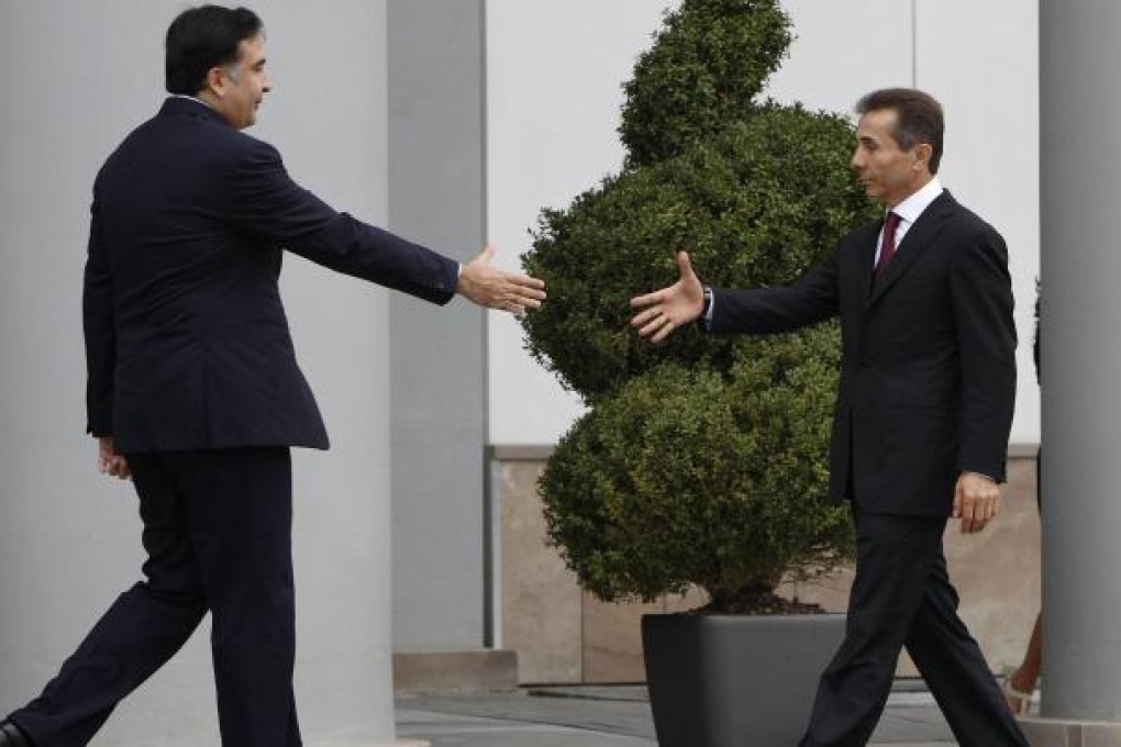 Georgia's Mikheil Saakashvili (left) meets Bidzina Ivanishvili.