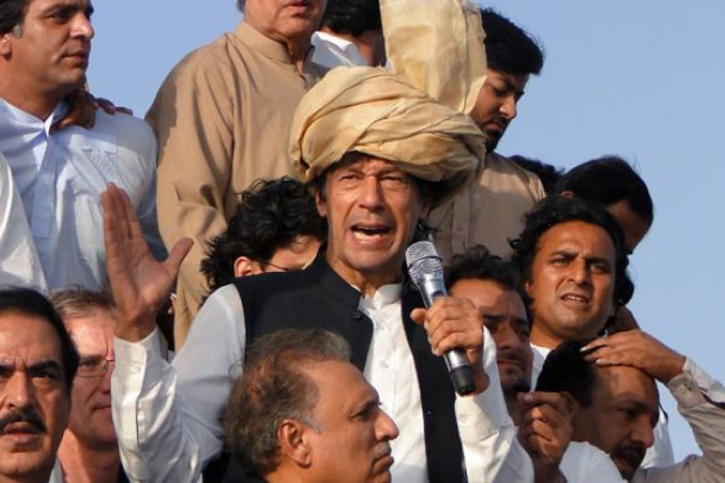 Pakistan's ex-cricket star-turned-politician Imran Khan (centre) addresses his supporters during a peace march in Tank, Pakistan, on Sunday. Photo: AP