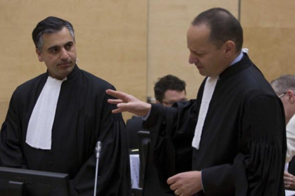 Payam Akhavan (left) and Phillippe Sands in the International Criminal Court before a public hearing on Libya's challenge to the admissibility of the case against Saif al-Islam Gaddafi in The Hague on Tuesday. Photo: EPA