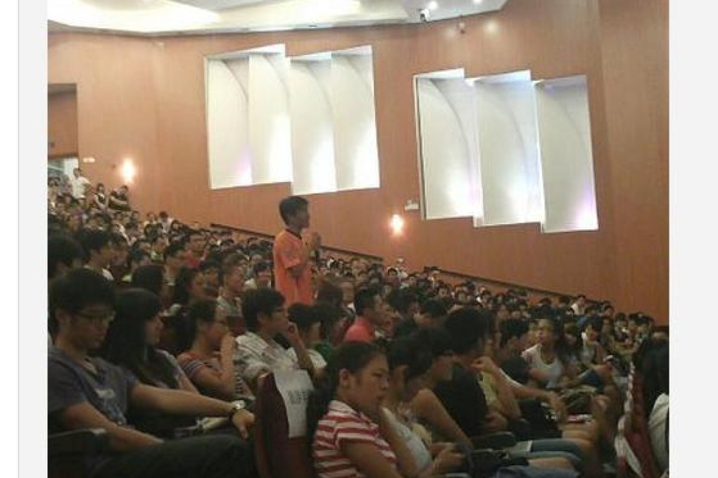 Sima's would-be assailant, minutes before his shoe missed its target.