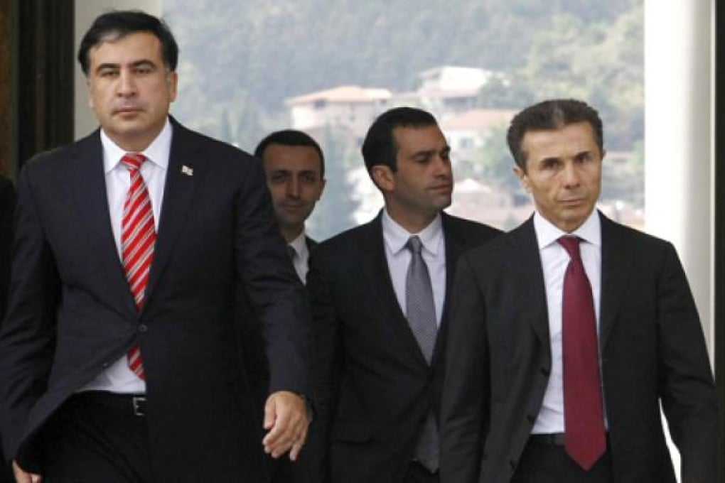 Georgian President Mikhail Saakashvili (left) and Bidzina Ivanishvili (right) the likely new prime minister, go to meet the press before their meeting at the Presidential Palace in Tbilisi, on Tuesday. Photo: AP