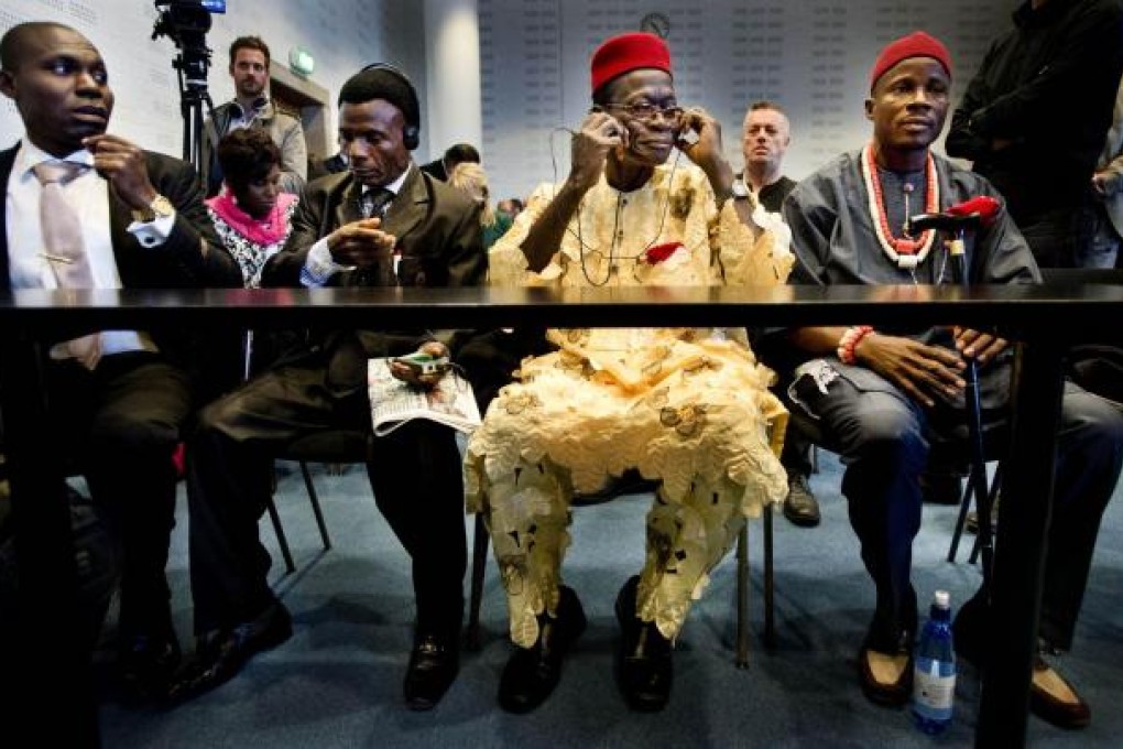 Two Nigerians want Shell to clean up its act. Photo: AFP