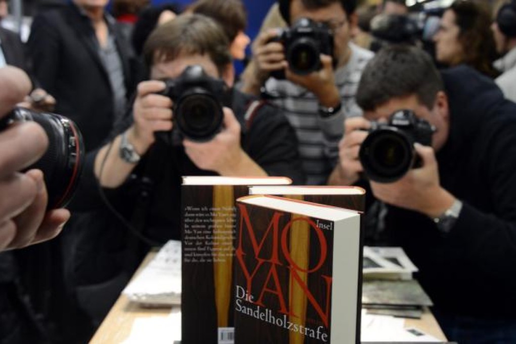 Mo Yan's books are the centre of attention yesterday at the 64th Frankfurt Book Fair. Some critics questioned his ability to thrive under a strict censorship regime. Photo: AFP