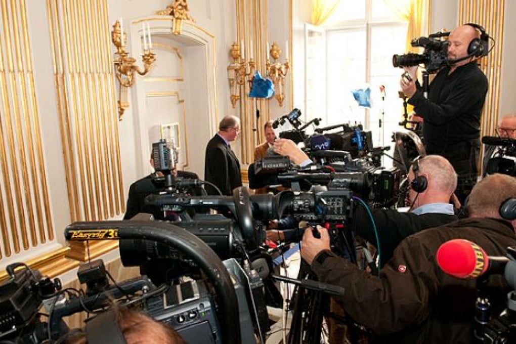 Journalists gather in Swedish Academy in Stockholm. Photo: Xinhua