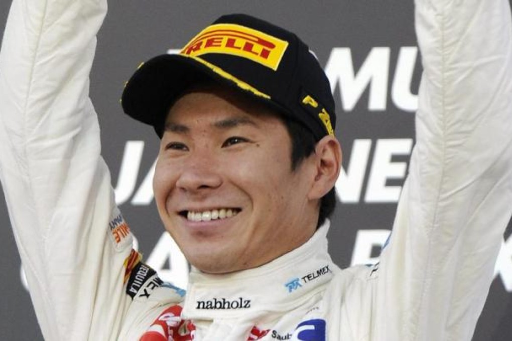 Kamui Kobayashi finally had something to celebrate with his third place in Suzuka. Photo: EPA
