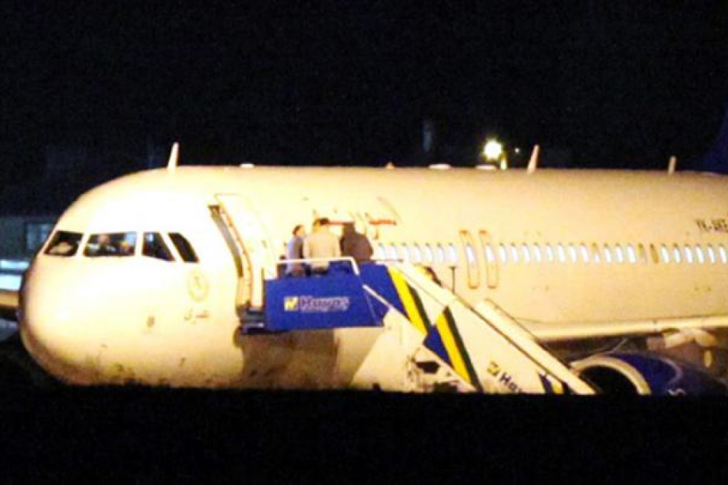 A Syrian passenger plane is seen after it was forced to land at Ankara airport on Wednesday evening on suspicions that it was carrying weapons. Photo: AFP