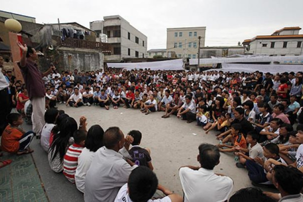 Residents of Wukan village in Lufeng, Guangdong province, gather to protest a land grab in September last year. Photo: Reuters