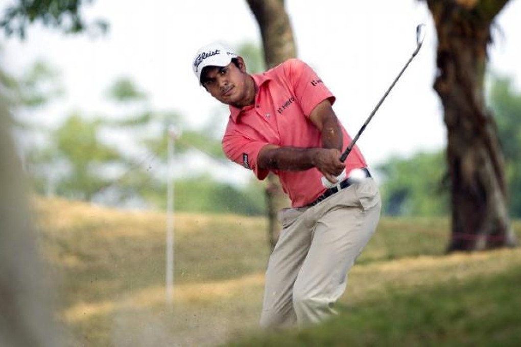 India's Gaganjeet Bhullar plays a shot from the rough on the ninth hole during the second round of the Macau Open.
