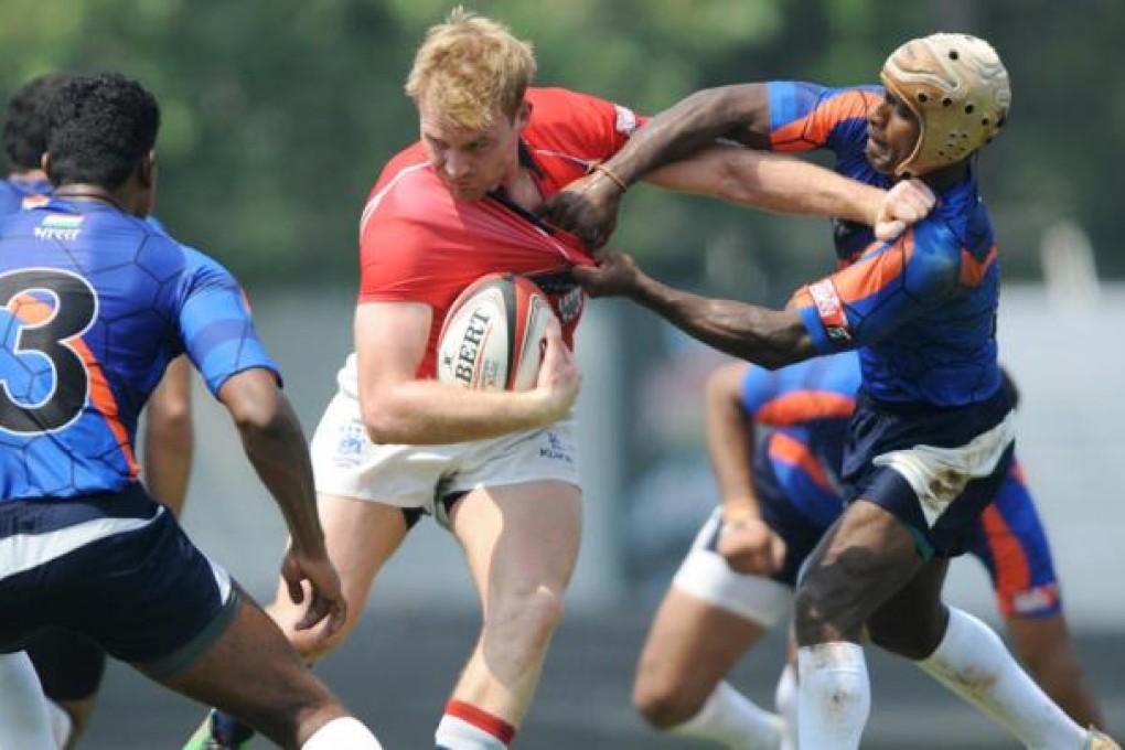 Jamie Hood stays on his feet during Hong Kong's 43-0 victory over India in Mumbai. Hong Kong are in the Cup quarters. Photo: SCMP