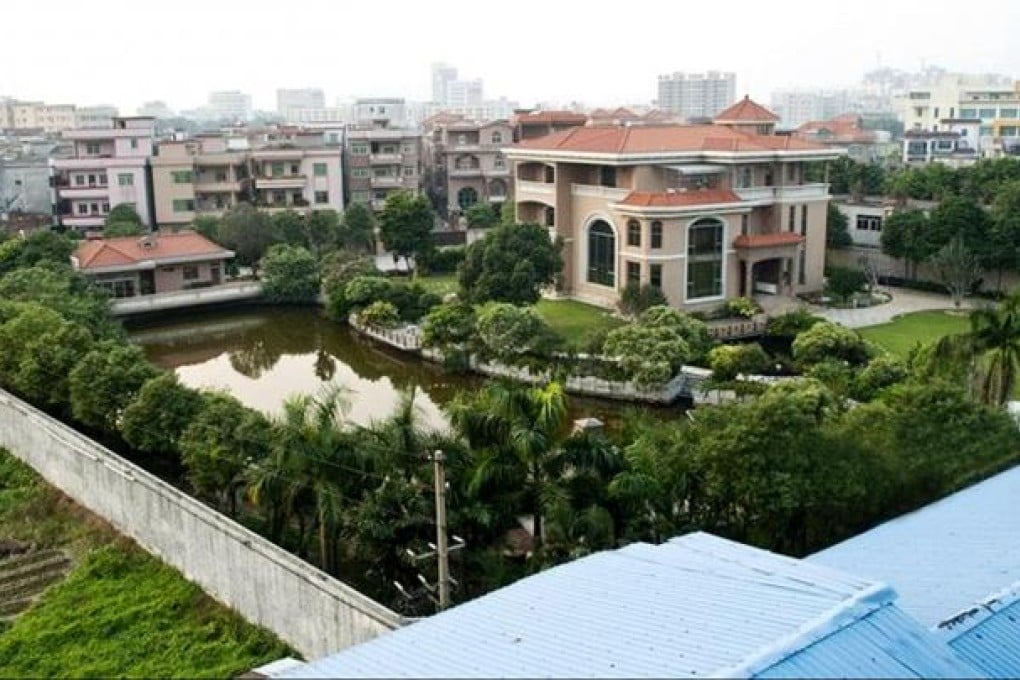 The three-storey house with fish pond, swimming pool, basketball court, artificial waterfall and landscaped grounds belonging to Chen Yaogen, party head of Yi village. Photos: SMP
