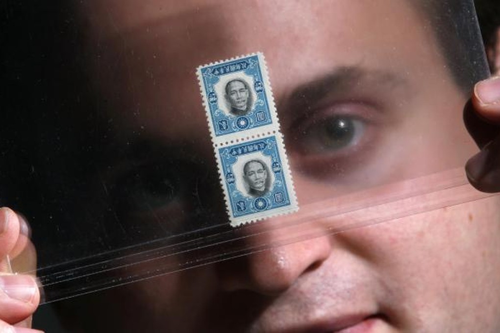 Zurich Asia director Louis Mangin with the stamps.