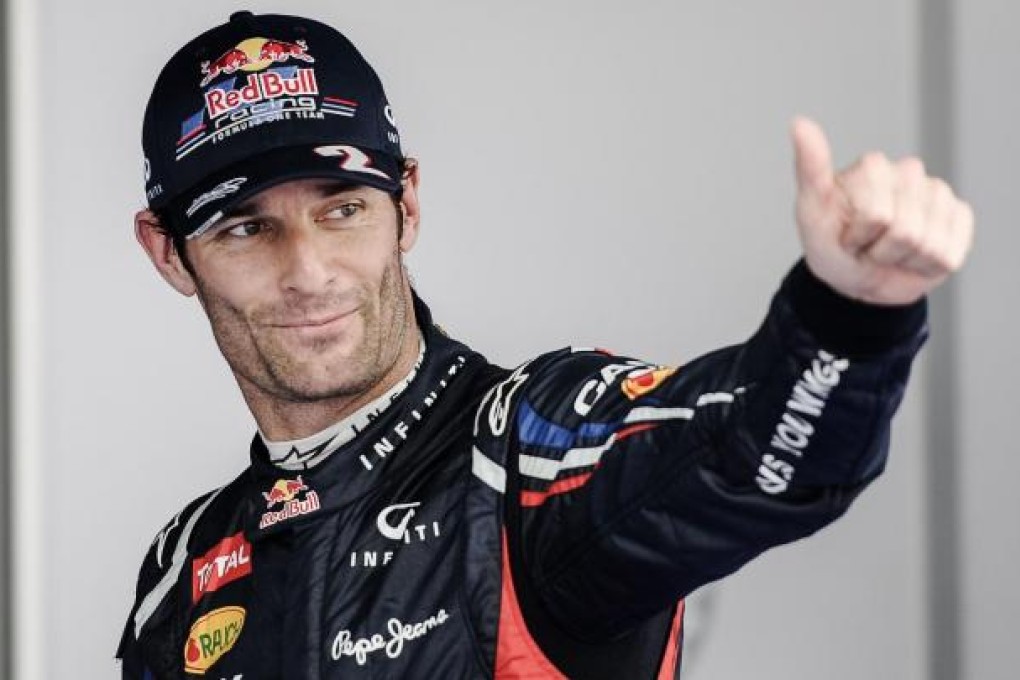 Red Bull driver Mark Webber gives a thumbs up to fans. Photo: AFP