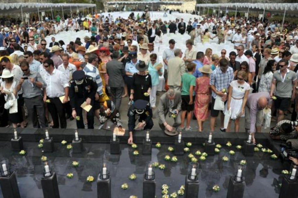 Survivors and relatives of victims of the 2002 Bali bombings pay tribute on the island to mark the 10th anniversary of the attacks. Islamic extremists killed 202 people, 11 from Hong Kong, in a terror campaign against tourists. Photo: AFP
