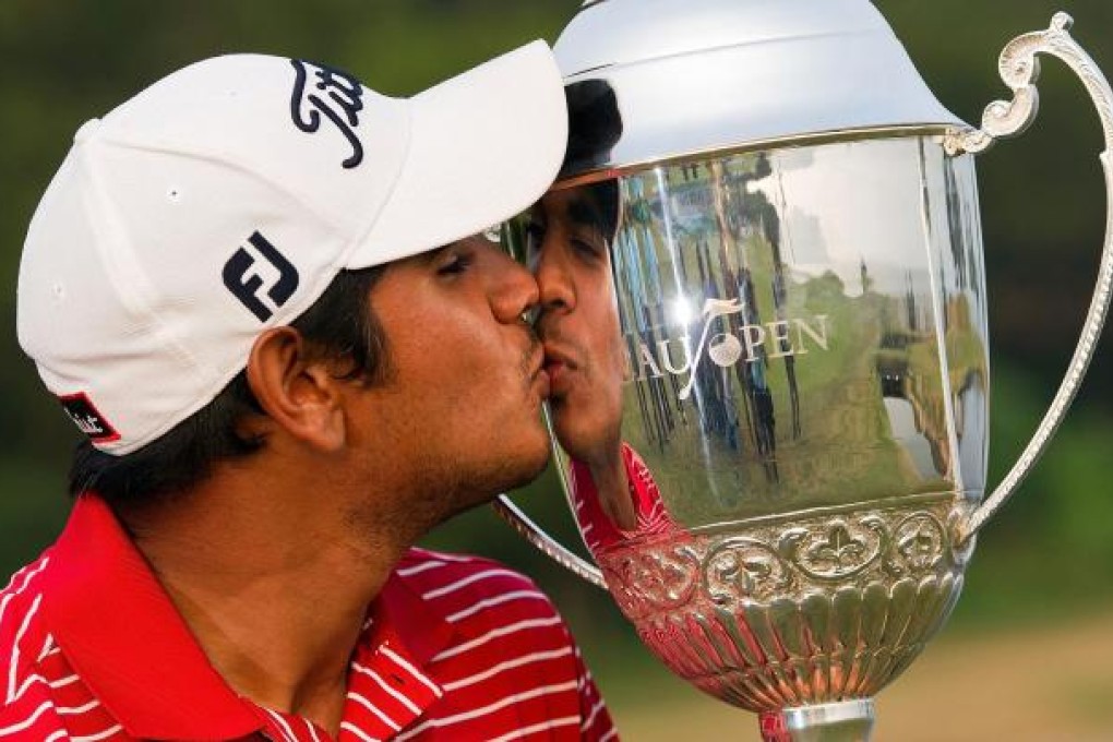 Gaganjeet Bhullar with his trophy at the Macau Golf and Country Club, where he finished with a 16-under 268. Photo: AFP