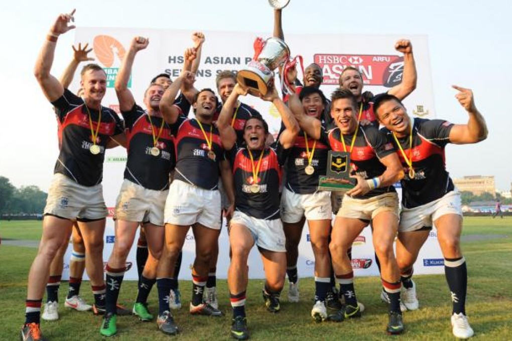 Hong Kong's victorious team celebrate after defeating Japan in the final to win the Mumbai Sevens. The victory makes Hong Kong the top sevens side in Asia. Photo: SCMP