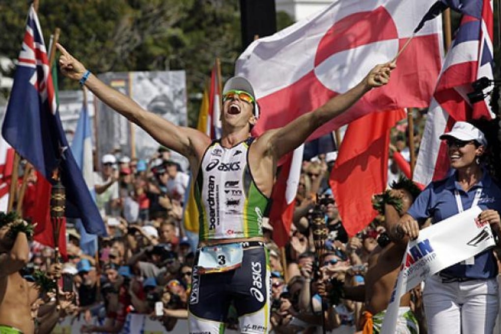 Australia’s Pete Jacobs celebrates his Ironman win on Saturday. Photo: AP