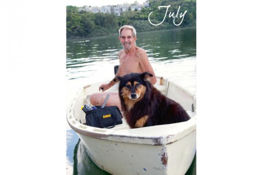 Peter Hansen posed with his strategically placed dog Lassie in his boat for July. Photo: Red Door News