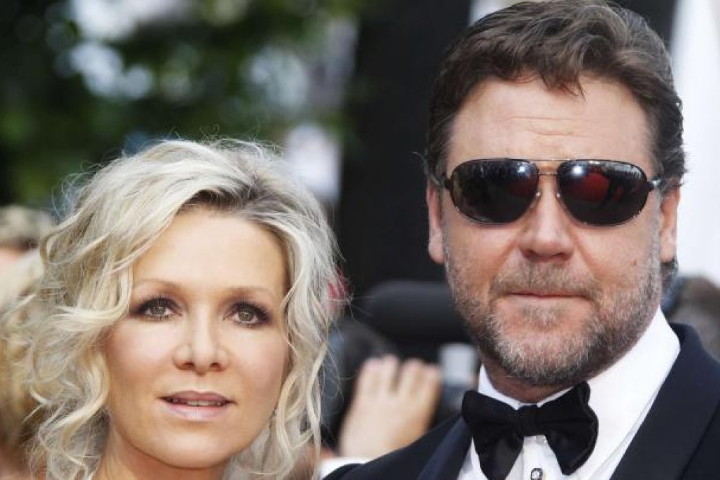 And cut: Russell Crowe and Danielle Spencer just before rumours first surfaced that their marriage was in trouble. Photo: Reuters