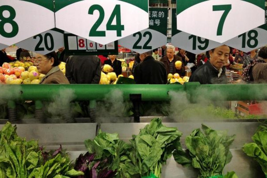 These prices at a Chengdu supermarket yesterday will have reflected a small gain from August. Photo: Xinhua
