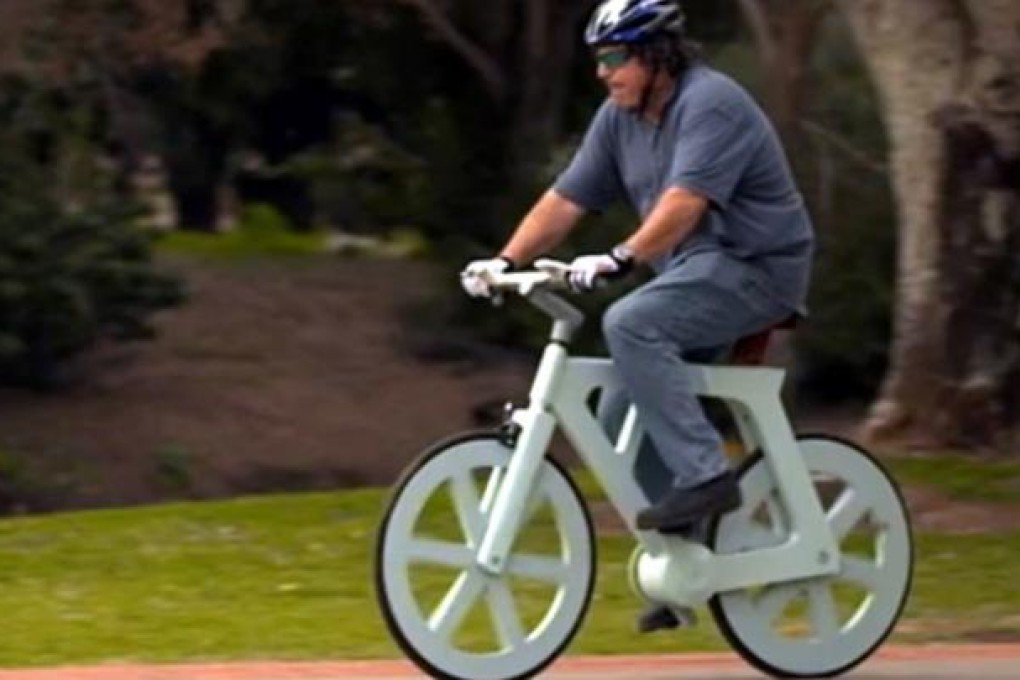 Izhar Gafni rides his cardboard bicycle. Photo: SCMP Pictures