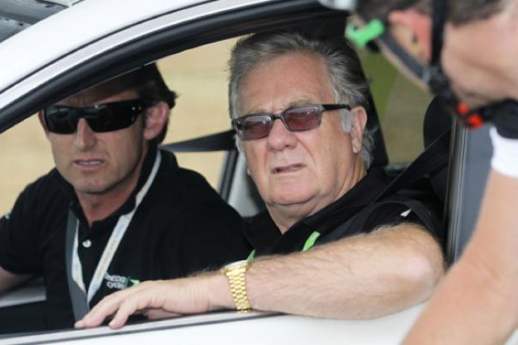Director of pro-cycling team Orica-GreenEDGE Matt White (left) and team owner Gerry Ryan (centre) talking with a team rider in January. Photo: AFP