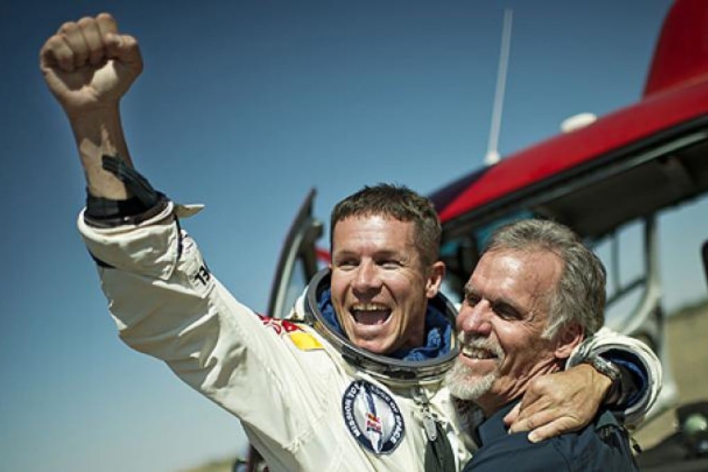 Felix Baumgartner with technical project director Art Thompson after the jump. Photo: AFP