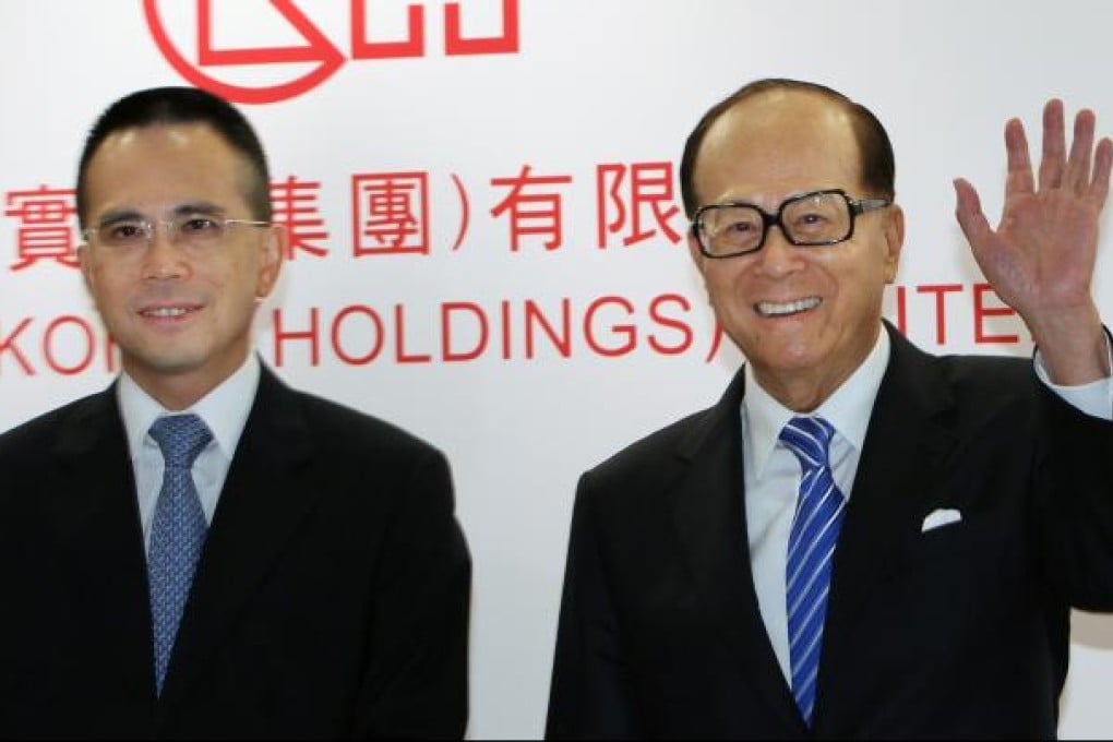 Victor Li Tzar-kuoi, left, with father Li Ka-shing, right,  at a Cheung Kong Holdings Limited news conference on May 25, 2012. Photo: SCMP