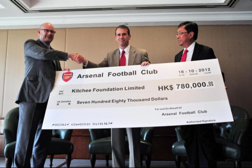 Tom Fox (centre) with Kitchee's Ken Ng Kin and Stuart Fraser.