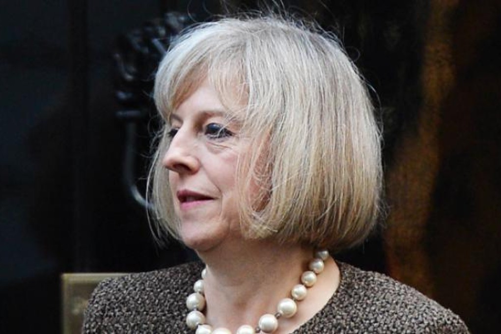 British Home Secretary Theresa May leaves 10 Downing street in central London on Tuesday. Photo: AFP
