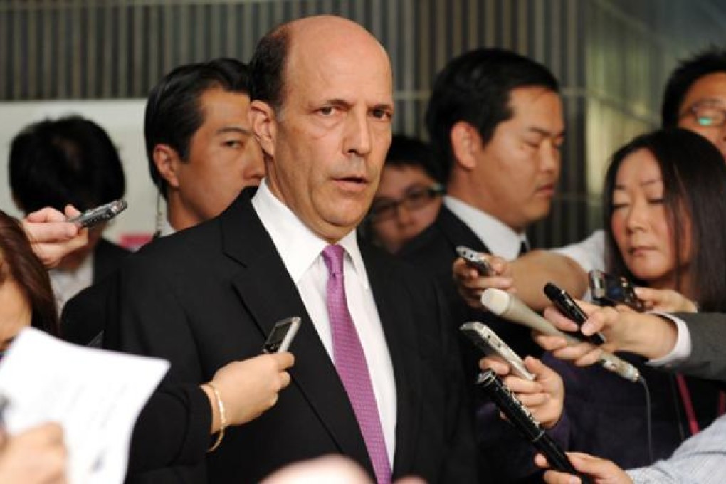 US ambassador to Japan John Roos (centre) is surrounded by reporters after his meeting with Japanese Senior Vice Foreign Minister Shuji Kira in Tokyo on Wednesday. Photo: AFP