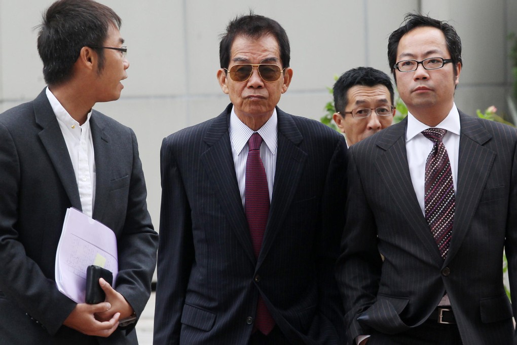 Brian Kan (centre) arrives at the High Court yesterday to appeal against his conviction for offering a bribe to a voter. Photo: K. Y. Cheng
