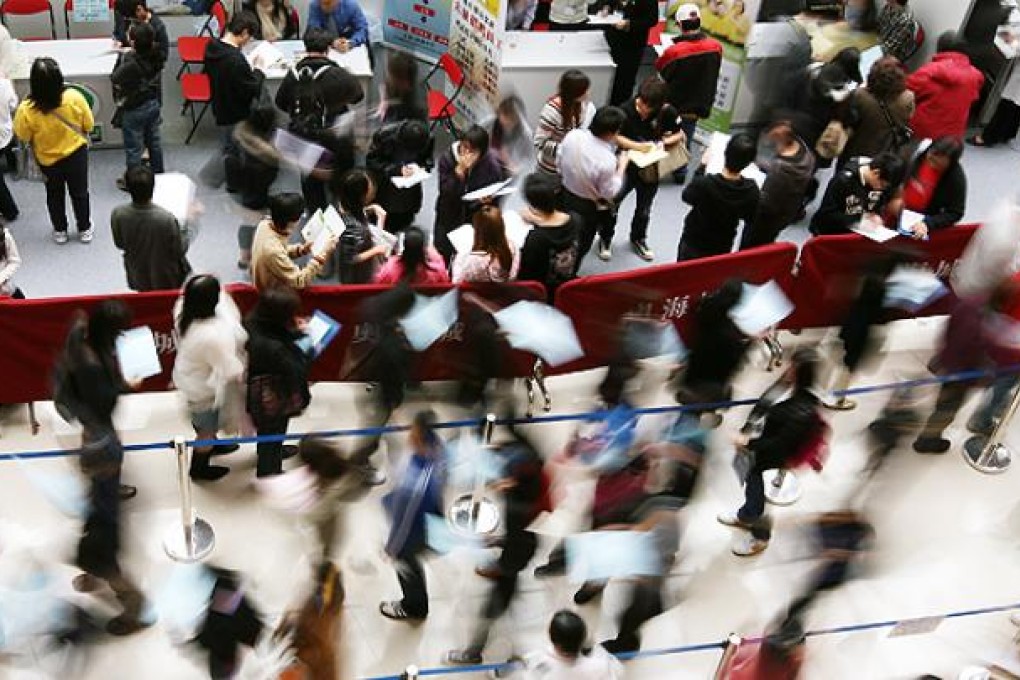 Job seekers attend an employment fair in West Kowloon. Photo: Ricky Chung