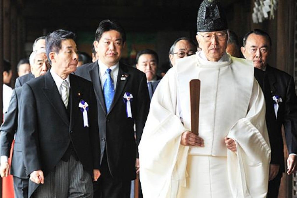 Japan's transport minister Yuichiro Hata (centre) and other lawmakers visit the Yasukuni Shrine in Tokyo on Thursday. Photo: AFP