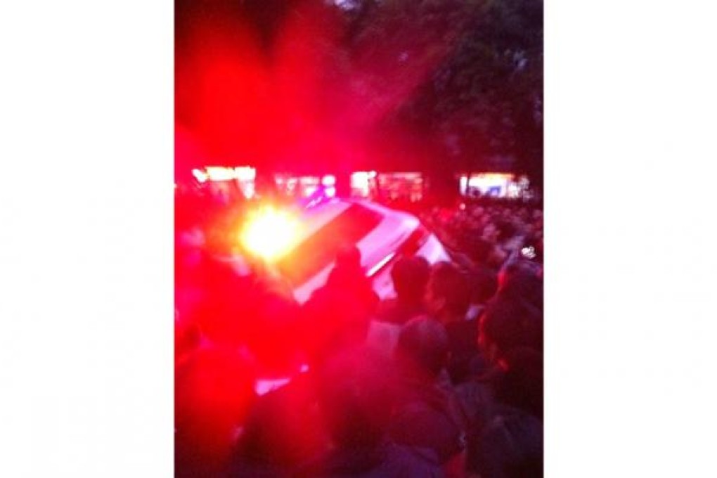 A police vehicle is overturned in Luzhou. Photo: SCMP