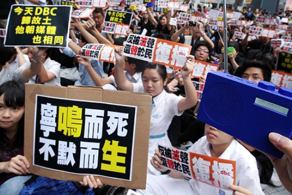 Supporters demand the reopening of DBC Radio outside government offices in Tamar. Photo: Felix Wong