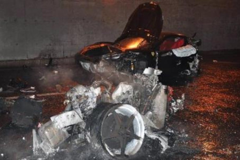 The smouldering remains of Ferrari 430 are scattered across Beijing's northern 4th Ring Road in this photo taken after a fatal accident on March 18, 2012
