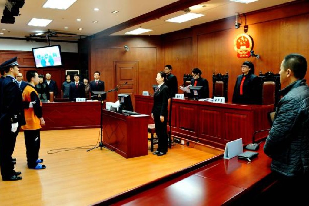 Li Mengnan stands trial at Harbin Intermediate People's Court. Photo: Xinhua