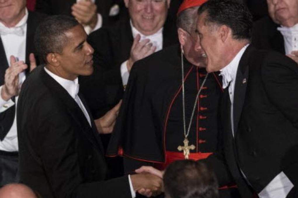 Republican US presidential candidate Mitt Romney and US President Barack Obama during the 67th annual Al Smith dinner at New York's Waldorf Astoria hotel on Thursday. Photo: AFP