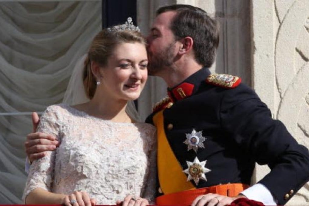 Stephanie, Hereditary Grand Duchess of Luxembourg (left) and Prince Guillaume, Hereditary Grand Duke of Luxembourg (right) after their wedding on Saturday. Photo: EPA