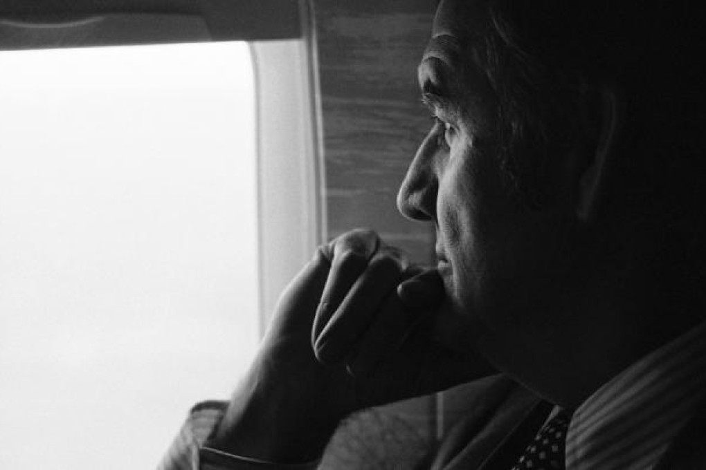 George McGovern looks out of plane window while campaigning in 1974. Photo: AP