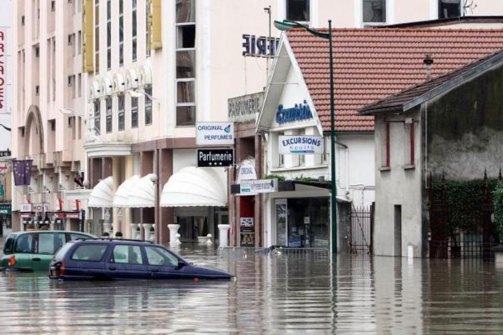 A massive clean-up was under way in the French pilgrimage town of Lourdes yesterday. Pilgrims were evacuated from flood-hit hotels. Photo: AFP