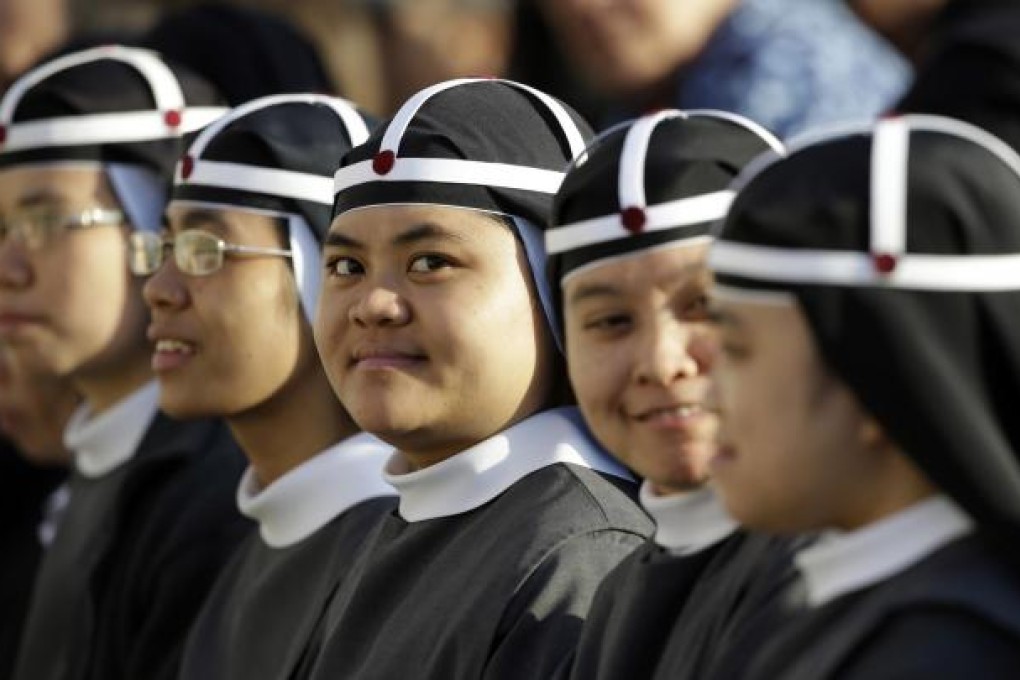 Filipino nuns attend the canonisation of seven people, including Pedro Calungsod. Photo: AP