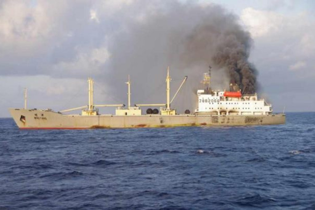 Smoke billows from the Chinese cargo ship Ming Yang, about 150 kilometres southeast of Japan's Okinawa island. Photo: AFP