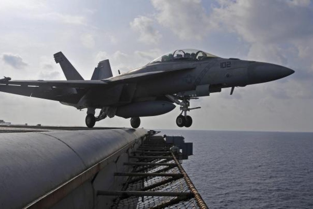 A navy aircraft takes off from the USS George Washington. Photo: EPA