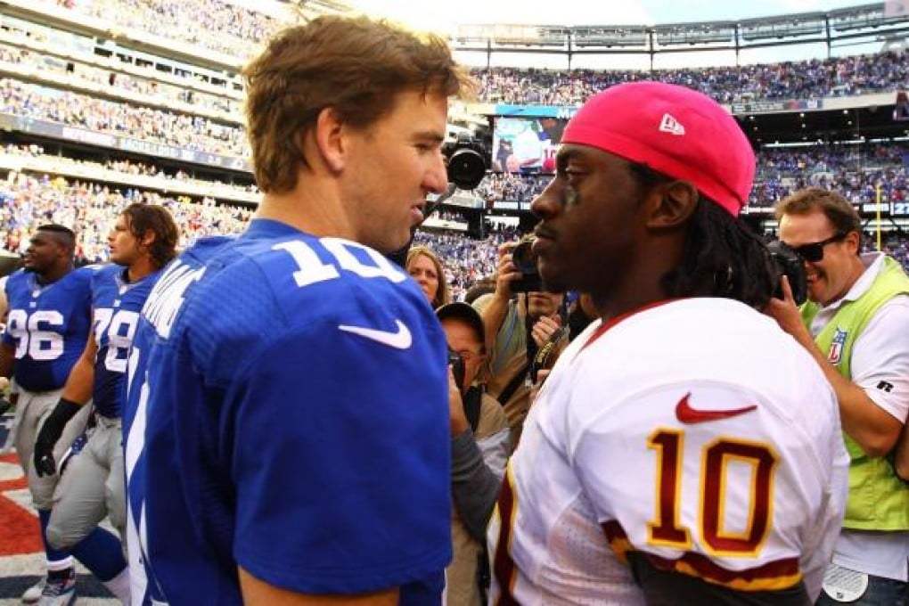 Giants' Eli Manning and Redskins' Robert Griffin III. Photo: AFP