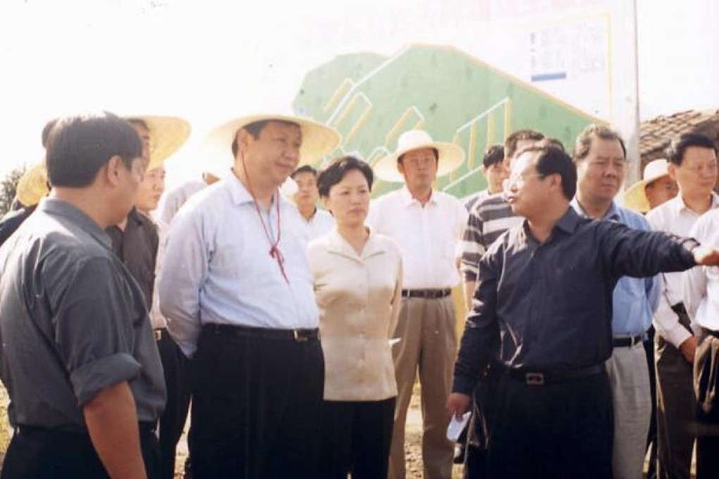 Xi (second left) visits a company in Fujian in 2001 during his time as governor of the southeastern province. Photo: SCMP