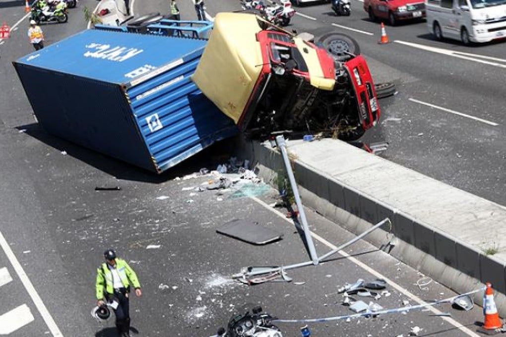 A container truck crashes on Ching Cheung Road on the Kwai Chung-bound lanes near Lai Chi Kok swimming pool. Photo: David Wong