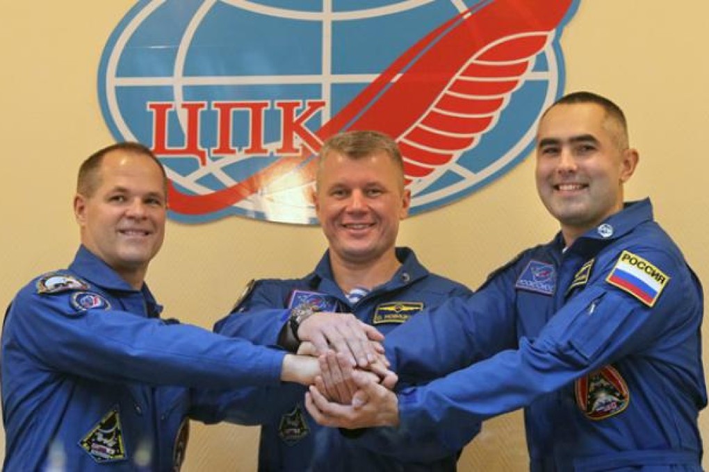Nasa astronaut Kevin Ford (left) and Russian cosmonauts Oleg Novitsky (centre) and Yevgeny Tarelkin at the Cosmodrome Baikonur on October 22. Photo: EPA