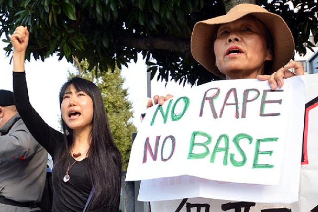 Civic group members protest against the rape of a local woman by two US servicemen in Okinawa outside the prime minister's residence in Tokyo. Photo: AFP